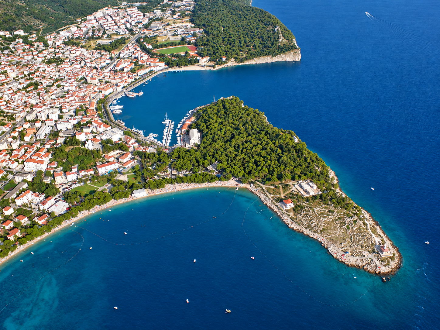 Aerial view of Sveti Petar peninsula and Makarska harbour